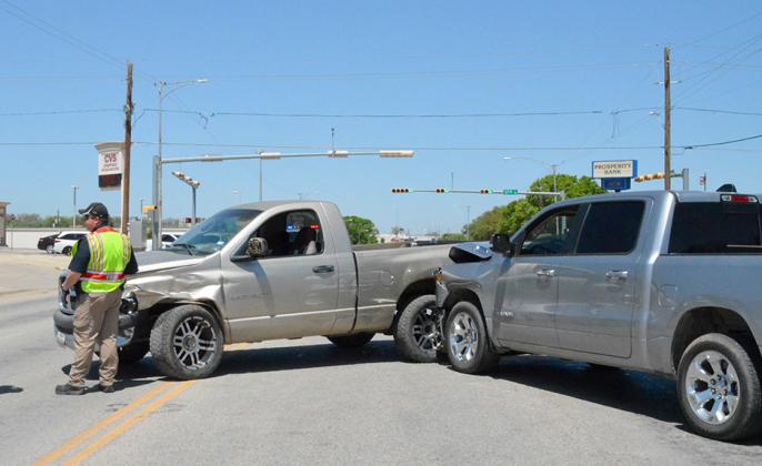 Fire Marshal Nathan Hines (left) responded to a two-vehicle accident on Thursday afternoon near the intersection of College Ave. and 37th Street. Snyder Police also responded. No injuries were reported.