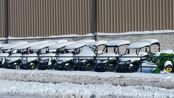 Pictured, snow covers a row of four-wheelers at Hurst Farm Supply in Snyder. 