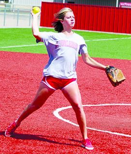 SDN Photo/Larry McCarty Hermleigh pitcher Kelsey Digby throws the softball to first base during infield practice.