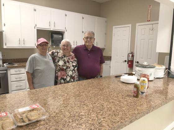 5n2 volunteers (l-r) Penny Womack, Marti Baze and Jack Richardson got ready for Wednesday’s meal.