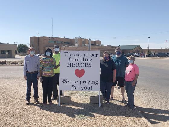 Trinity United Methodist Church members (l-r) Ted Billingsley, Lillie Rodgers, Pastor Larry Rodgers, Jeanita McIlroy, Steve McIlroy and Donna Browning created a sign to celebrate Snyder first responders.