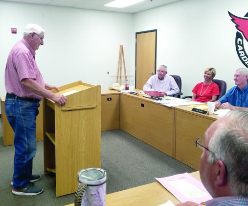 Former Hermleigh head football coach Clarence Spieker (left) thanked the Hermleigh school board and administration at Tuesday’s school board meeting for their role in renaming Cardinal Stadium in his honor. Also pictured are board president  (l-r) Larry Don Nachlinger, Superintendent Cassie Petty, board member Joe Taylor and Hermleigh Principal Nathan Pettigrew.