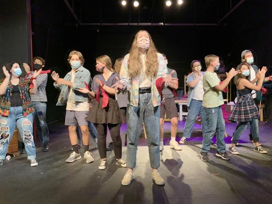 The Godspell cast, including (l-r) Olivia Haley, Sebastian Sosa, Jaden West, Shelby Powell, Gillian Crist, Brody Jasso, Kaylee Rush, Jaxon West, Madalyn Hernandez, and Isaac Garcia rehearsed choreography for one of the songs in the musical.