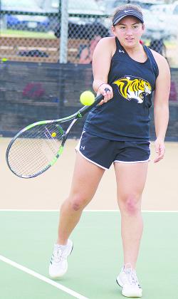 Carolyn Stelluti returns a shot during Thursday’s match against Borger. Snyder lost to Borger, 12-7.