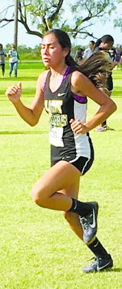 Snyder’s Kelcie Rodriguez pushes up the hill during the high school girls’ race at the Hamlin cross country meet. Rodriguez finished 21st to help the team finish eighth overall.
