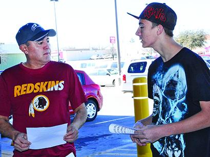 Snyder High School student Joshua Brock (right) explained the Blessings in a Bag program to Joe Garza during Saturday’s food drive at United Supermarkets. The program provides eligible Snyder ISD students with food for the weekend during the school year.
