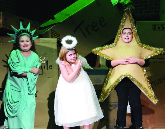 Snyder Christian School students (l-r) Kylee Wells, Shelby Powell and Sydney Ubando portrayed toys during Tuesday’s performance of Christmas Hang Ups.