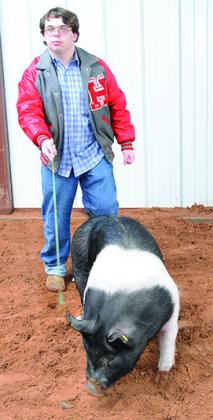 Jonah Ferris walked his pig Thursday in preparation for Saturday’s chapter show.