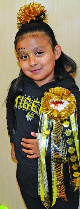 Snyder Elementary School students wore homecoming mums to school today, including second grade student Gabriela Benitez. Snyder schools had an early release today in order to participate in or watch the homecoming parade and attend the pep rally. Snyder will host Midland Greenwood in the annual homecoming game at 7:30 p.m. today.