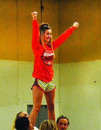 Alyssa Martini practiced a cheer in preparation for the state championships.