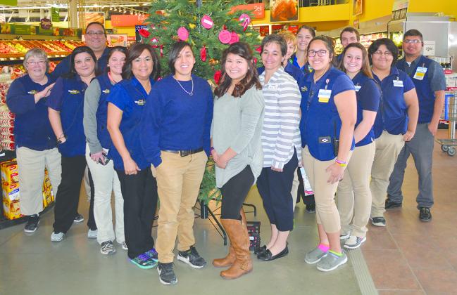 Standing in front of Amy’s Angel Tree are Snyder Walmart associates and West Texas Children’s Advocacy Center representatives (l-r) Paula Uruh, Rebecca Burk, Avan Ceballos, Micayla Redman, Dora Little, Kelly Martinez, Alura Silva, Jennifer Foust, Brenda Greenwood, Shandy Miller, Dariela Pinney, Chris Wind, Audrey Tollison, Merecedes Navarette and Adam Negrete. Residents may pick one of the 150 names off the tree to buy Christmas gifts for children. 