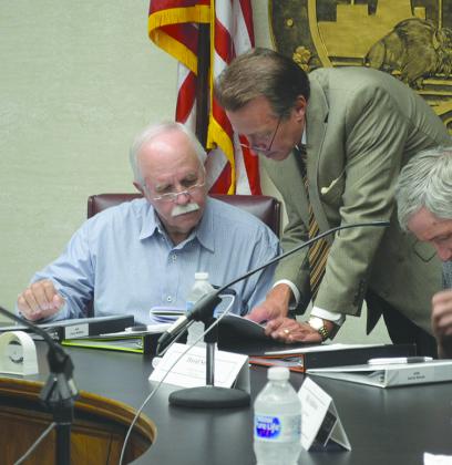 ARB Chairman Jimmy McMillan (left) confers with ARB attorney Roy Armstrong prior to the start of today’s meeting.