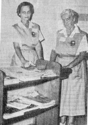 One of the early responsibilities of the Auxiliary was distributing magazines to patients. Pictured in this 1961 photo are Mrs. Carl Herod and Mrs. Hugh Taylor.