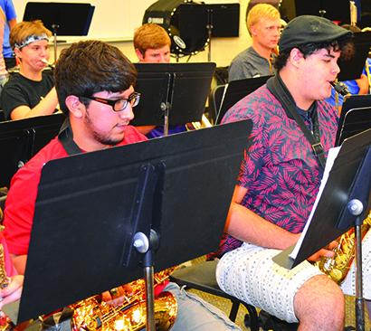 Pride of the West Marching Band members (front row) Edward Leal and Jonah McGuire and (back row) Abbey Stephens, Zack Lewis, Zach Nobles practice for the upcoming season.