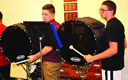 Percussion members Brody Thompson (left) and James Ashlock practice on Tuesday.