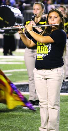 Snyder High School Pride of the West flute player Zowie Rodriguez and clarinet player Oriana Renshaw perform during halftime of the Snyder High School football game at Big Spring last week. The band will begin its marching competition season Monday at the Big Country Marching Festival at Bulldog Stadium in Abilene.