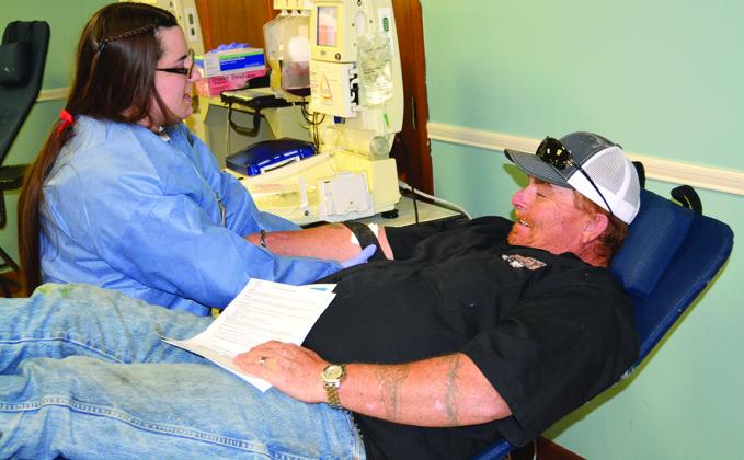 Amberlyn Unger prepared Greg Cole to donate blood during Tuesday’s Cogdell Memorial Hospital Auxiliary’s community blood drive at Colonial Hill Baptist Church.