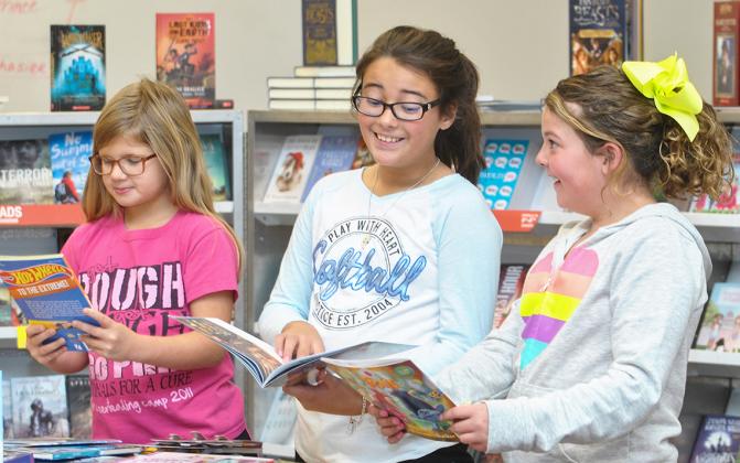 Hermleigh High School’s National Honor Society is hosting an Interscholastic Book Fair this week at the school. It will be open 8 a.m. to 4 p.m. Thursday and the hours will be extended from 8 a.m. to 7 p.m. on Friday for family night. Pictured browsing some of the books being offered are fourth graders (l-r) Reese Elder, Hailey Minton and Raelee Leatherwood.