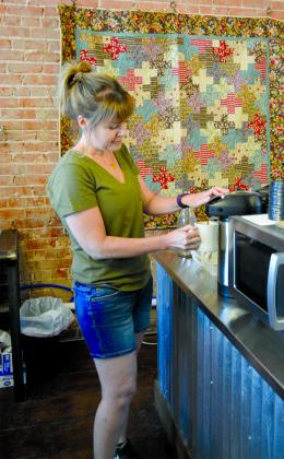 Times Square Frozen Yogurt & Coffee House manager Brooke Proctor poured a cup of coffee for a customer.