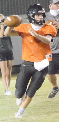 Ira sophomore quarterback Bryton Partain made a running throw during Midnight Madness at Bulldog Stadium Friday. Partain takes over at quarterback for the Bulldogs following the graduation of three-year starter Nathan Goodwin.