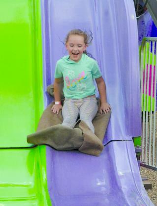 A’Lexus Berry went down the slide at the carnival Friday night.