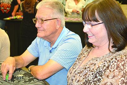 Jack and Donna Richardson contemplate their next moves while playing blackjack at the Cogdell Memorial Hospital Foundation’s Casino Night fundraiser at The Coliseum Saturday.