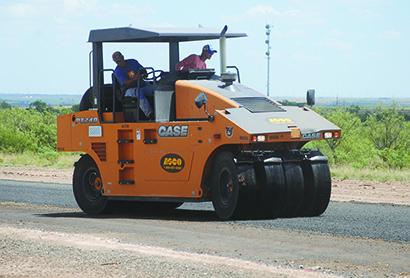 Construction crews from Lone Wolf Construction, LLC, tested the surface after laying down chip-seal this week on Cavendar Road. The road is projected to be finished by this weekend. 