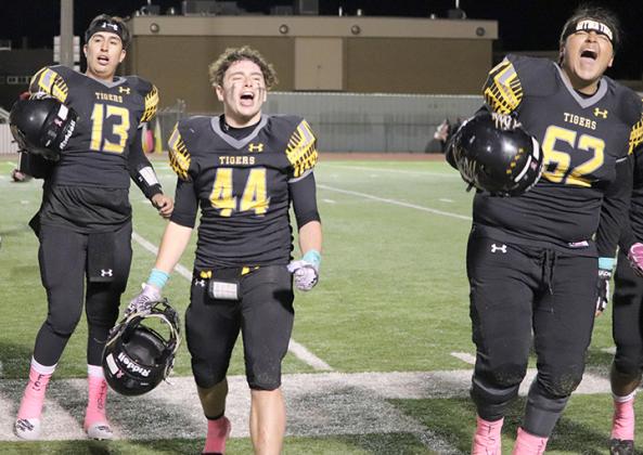 Snyder’s Leeroy Tavarez (13), Talon Lee (44) and Luis Vasquez (62) celebrated the Tigers’ 35-34 win over Sweetwater at Tiger Stadium Friday. Tavarez threw for 165 yards and Lee recovered a fumble in the win, while Vasquez and the running game racked up 222 rushing yards.