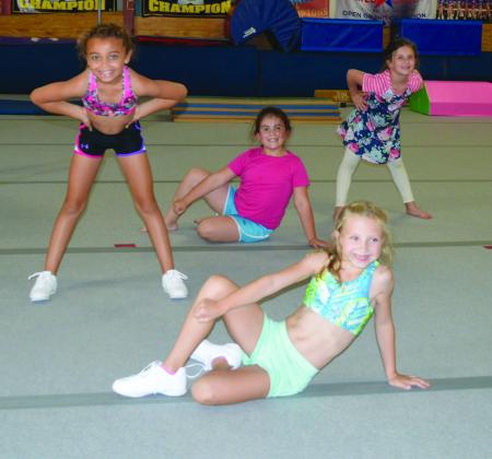 Stars R Us gymnasts (pictured front to back) Taryn Tyler, Chloe Henson, Bella Garcia and Avery Scott rehearsed for this weekend’s White Buffalo Days performance. The group is scheduled to perform at 11 a.m. Saturday at the Scurry County Courthouse gazebo.