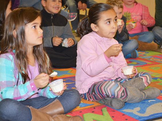 Aubrey Perez (left) and Andrea Aguirre ate ice-cream and listened to a story about how Christmas is celebrated in Australia.