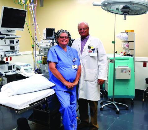 Cogdell Memorial Hospital operating room technician Carmen Timora and Dr. Teb Thames stand inside one of the two new operarting rooms on the third floor of the hospital. The first operations in the surgical wing were performed this week.