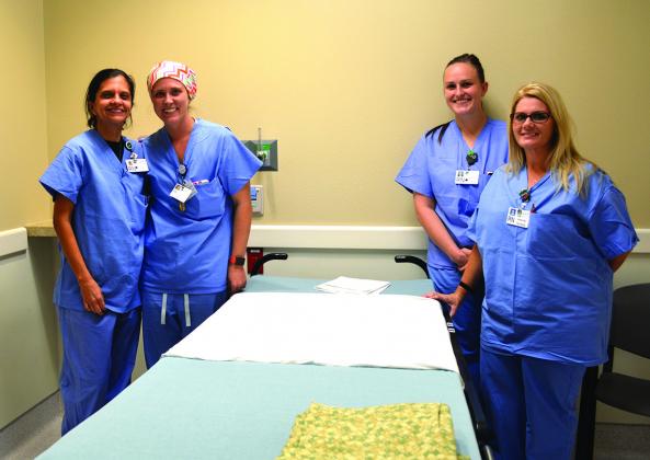 Cogdell Memorial Hospital operating room nurses (clockwise from left) Jeanne Trieger, Sarah Whitney, Wendy Halmon and Wendy Cooley stand in one of the recovery bays in the new surgical wing.