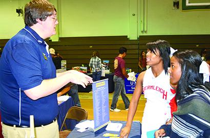 Will Massey (left), an admissions counselor at Howard Payne University, talked to Hermleigh students Aaliyah and Brishaya Sneed at College Day on Thursday at Western Texas College.