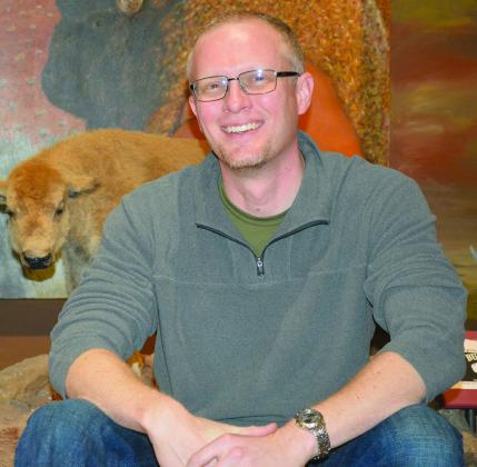 Pictured is Scurry County Museum Director Daniel Schlegel Jr. in the museum’s permanent gallery. A reception for Schlegel, who accepted a position as museum operations manager position at the Colorado School of Mines Geology Museum, will be held from 5-7 p.m. Monday at the museum.