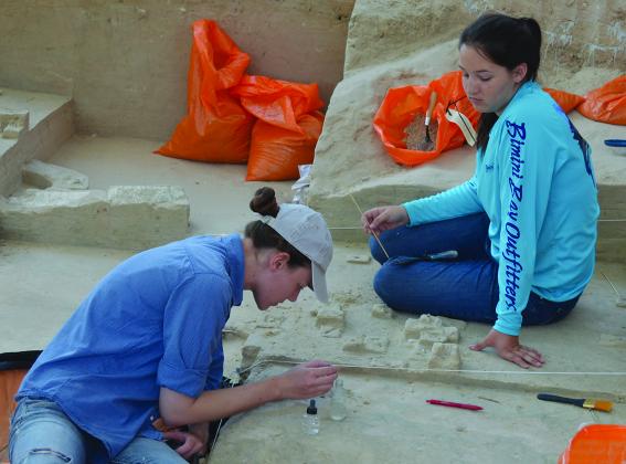 Lila Jones (left), of the Museum of Texas Tech University, and volunteer Megan Berry uncovered ancient animal bones.