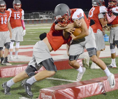 Hermleigh junior Bubba Digby (right) tried to power past junior Stetson Digby during a drill at the Cardinals’ Midnight Madness at Clarence Spieker Stadium Saturday. The Cardinals will travel to Trent for a scrimmage at 9 a.m. Saturday.