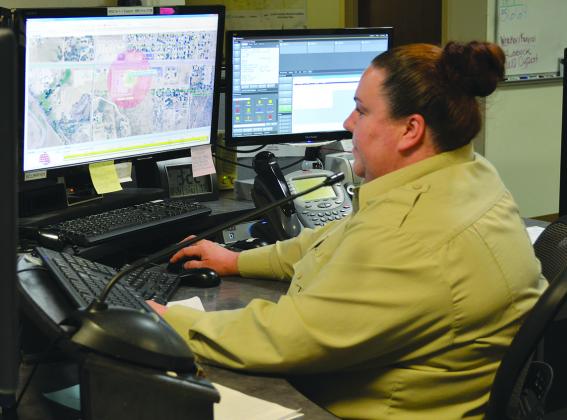 Dispatcher Robbin Smith familiarized herself with a map.