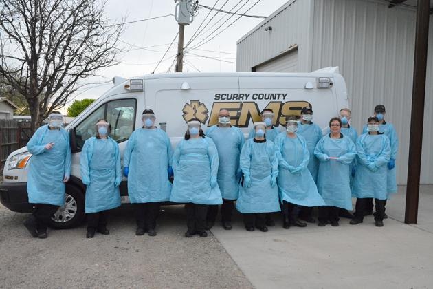 Scurry County EMS staff donned their personal protection equipment during a practice run on Wednesday. Pictured (l-r) are Jason Tyler, Heather Bishop, Russel Thomas, Ashley Jones, Jimmy Futrelle, Norma Miller, Jarrod Greene, Katrina Reynolds, Jeremy Moody, Cindy Josey, Zach Nobles, Shane Terry and Joseph Asher.