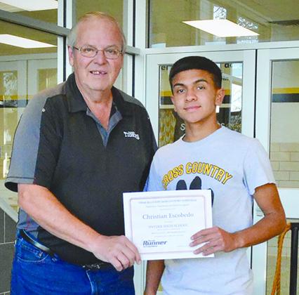Snyder head cross country coach Bob Campbell (left) presented Escobedo with an all-state recognition award. Escobedo is a three-time state finalist in cross country.