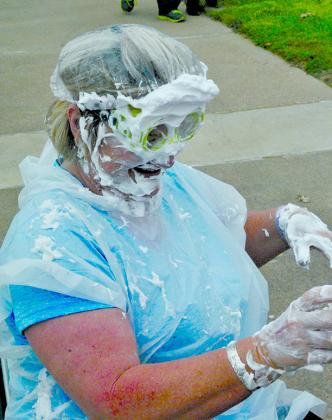 Snyder Primary School Principal Canita Rhodes reacted after getting hit with a shaving cream pie during the Scurry County United Way’s County Fair on the Square Saturday afternoon.