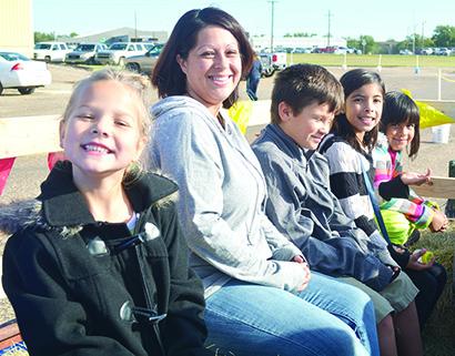 Pictured are (l-r) Penelope Spiegel, Yvette Cerda, Joseph Rosas, Ariah Luera and Ariana Martinez getting ready to go on a hay ride at the Snyder Farmers Market on Saturday at The Coliseum. It was the fifth and final farmers market of 2016. 
