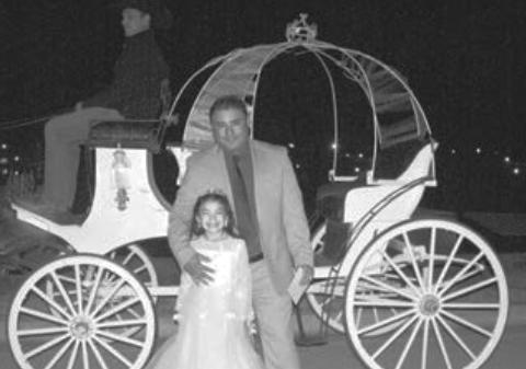 At last year’s father-daughter dance hosted by Shining Star Sports, Skye Perez (left) and her father, Alberto, enjoyed a Cinderella-themed carriage ride guided by Keith Messick. This year’s dance is Saturday, and the theme is The Little Mermaid.