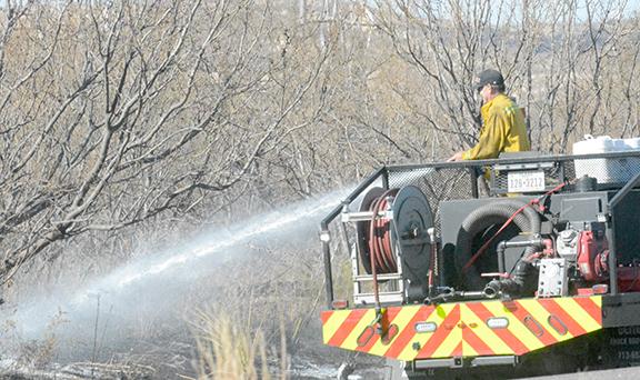 A firefighter battled a brush fire on Highway 84 near Fluvanna Tuesday around noon. The Fire Department received several calls reporting grass fires in the area along Hwy. 84 between CR 2134 and Fuller Ranch Road shortly after 11 a.m. Tuesday. The Fire Department was able to bring the fire under control and extinguished it early Tuesday afternoon.