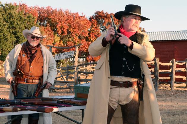 SASS members Michael Travis (left) and Eddie Lewis (right) showcase replicas of historic guns.