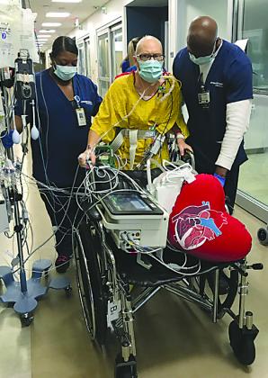 Colorado City resident Heath Erwin (center) walked several hours after his heart transplant. 
