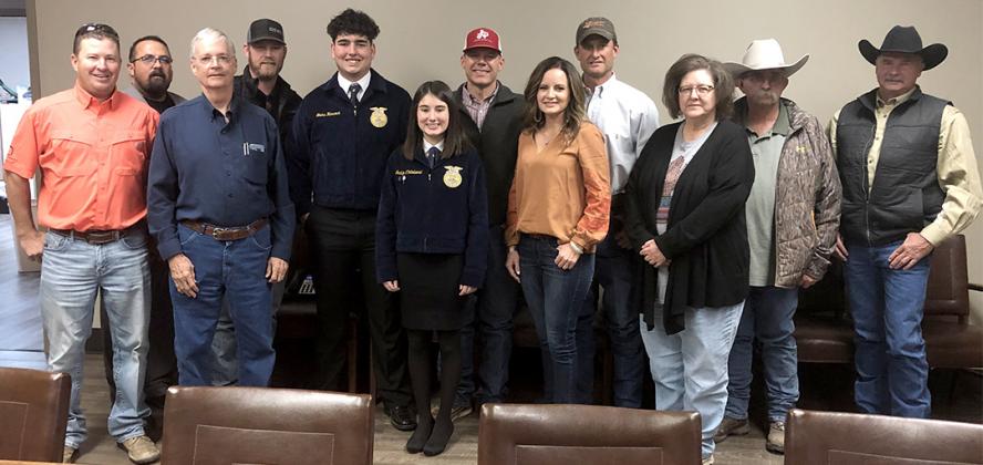Hermleigh FFA members Blake Hancock and Jacklyn Clinkinbeard (fifth and sixth from left) posed with Hunter Appreciation board members after accepting a scholarship check. Tuesday. Pictured are (l-r) Reese Grimmett, Kenny Miller, Drew Bullard, Jason Bynum, Hancock, Clinkinbeard, Hermleigh ISD teacher Cody Womack, Jamie Price, Brad Hart, Melissa Kruger, Richard Kruger and Dennis Taylor.