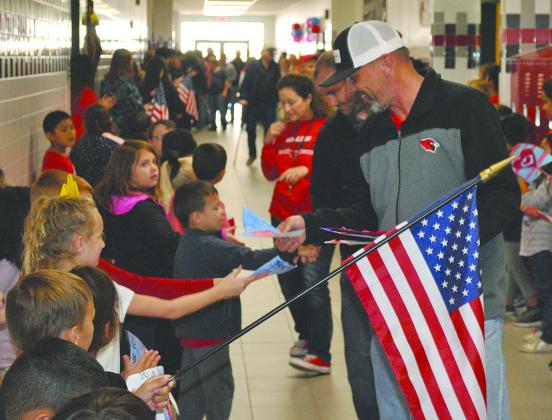 Students line the halls and interact with local veterans during Hermleigh ISD’s Veterans Day program in 2018.