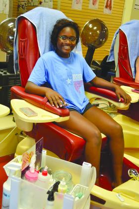 Snyder High School homecoming queen nominee Kerrington Biggers enjoyed a manicure and pedicure at Le Nails and Spa.