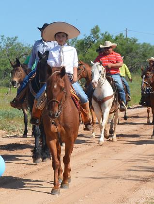 Adan Martinez, 11,  rides in a “cabalgata” in honor of Saint John the Baptist and the Virgen de San Juan de Los Lagos Jalisco Saturday with 19 other riders. The three-and-a-half-hour ride began in Hermleigh and ended in Dunn. 