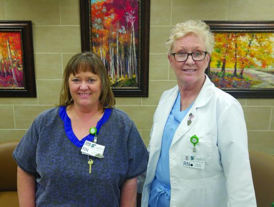 Lisa Luecke (left) and Laquita Culwell are asking area residents to stop by their desk in the main lobby of Cogdell Memorial Hospital this month to fill out forms designating medical power of attorney and advanced directives for medical personnel to follow in case of a serious injury or illness. The forms may be picked up every Tuesday afternoon and Thursday morning.